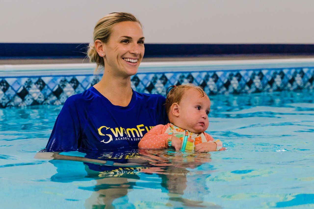 SwimFun director of aquatics Paige Kirshner works with an infant as part of the survival aquatics program.